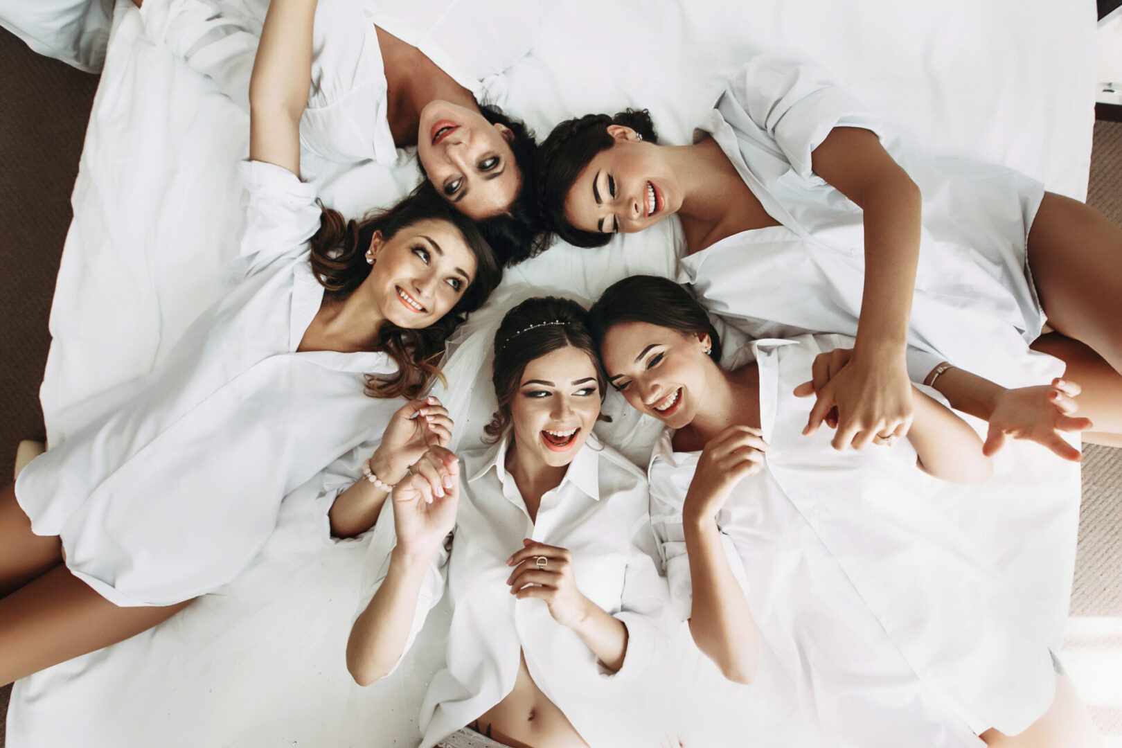 Bridesmaids on a bed