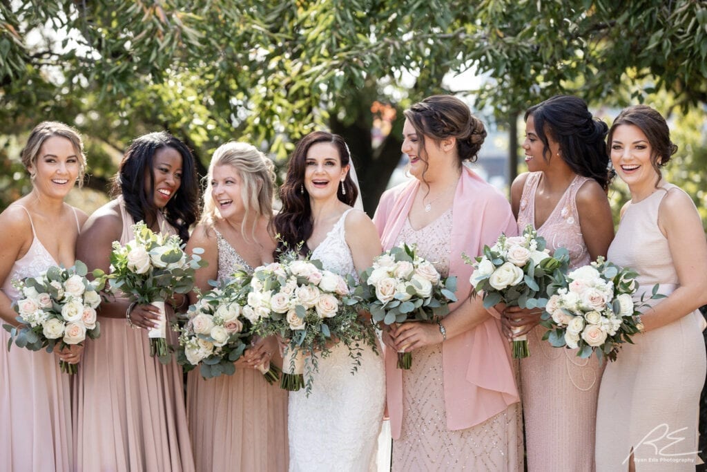 Philadelphia Bride and bridesmaids showing off hair and makeup at Waterworks in Philadelphia