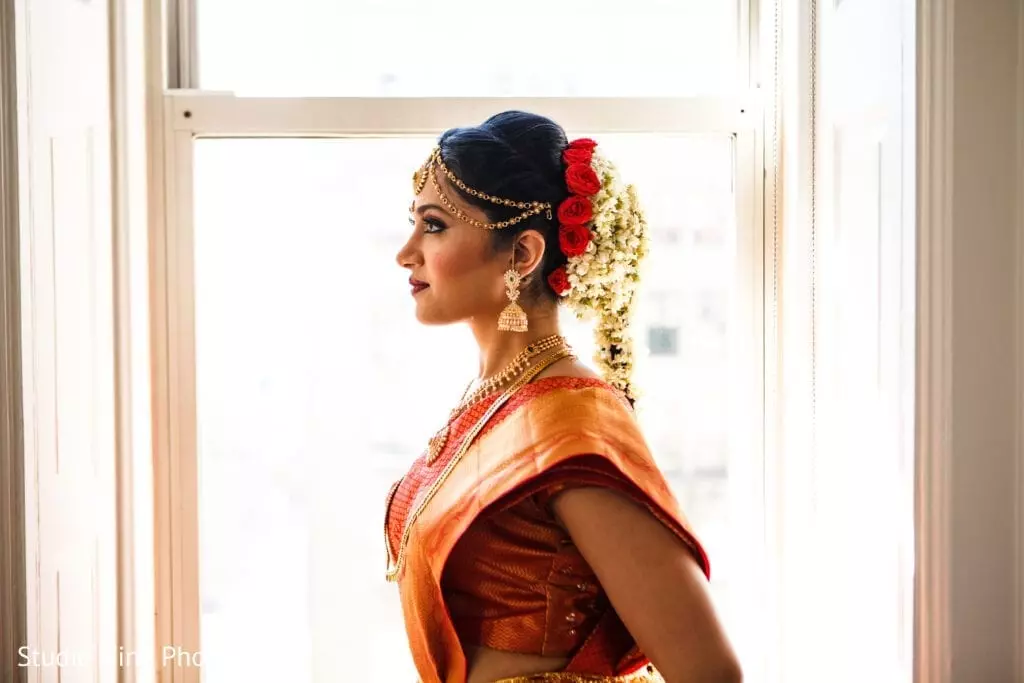 Beautiful South Asian bride showing off hair and makeup