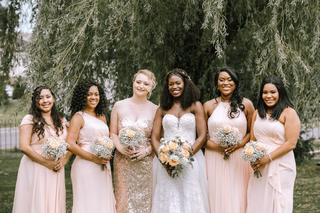 African American bride with bridesmaids