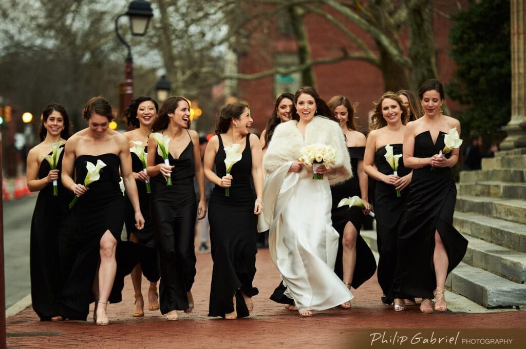 Bride and bridesmaids walking down the streets of Philadelphia