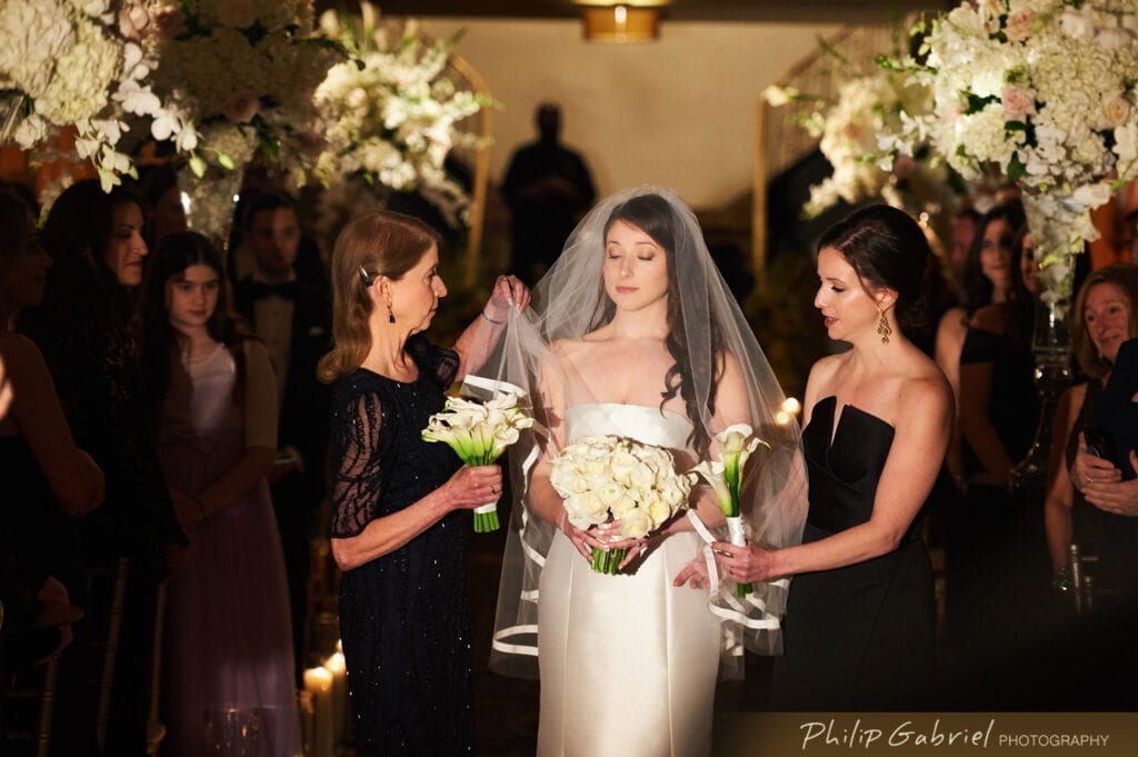 Bella Angel bride with mom and sister at Ballroom at the Ben Philadelphia walking down the aisle