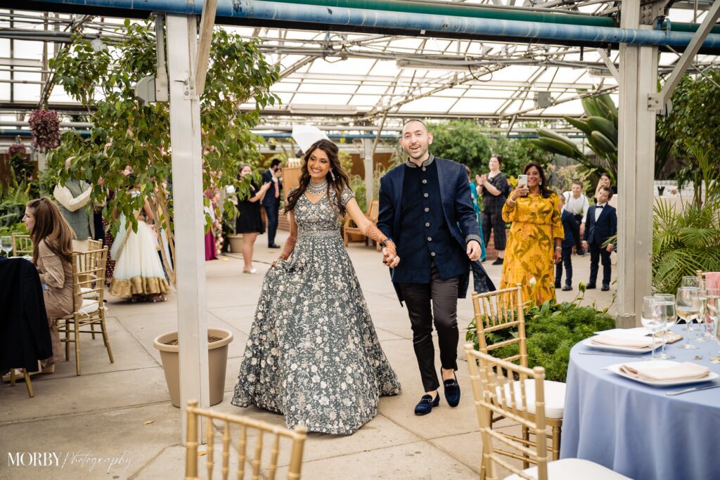 Indian Bride and groom arrive at reception