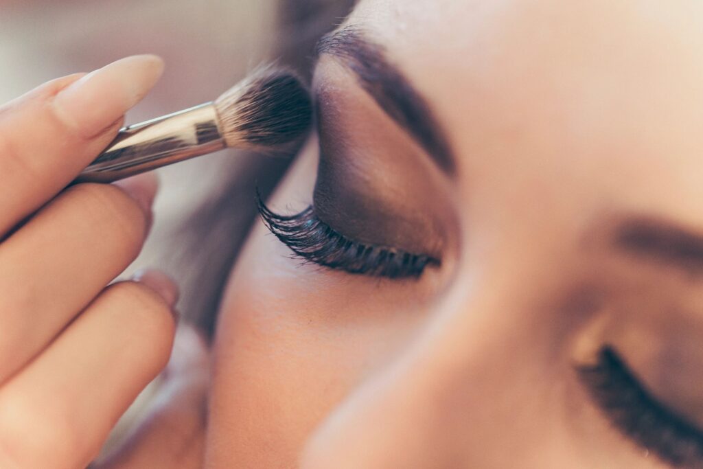 makeup artist applying makeup